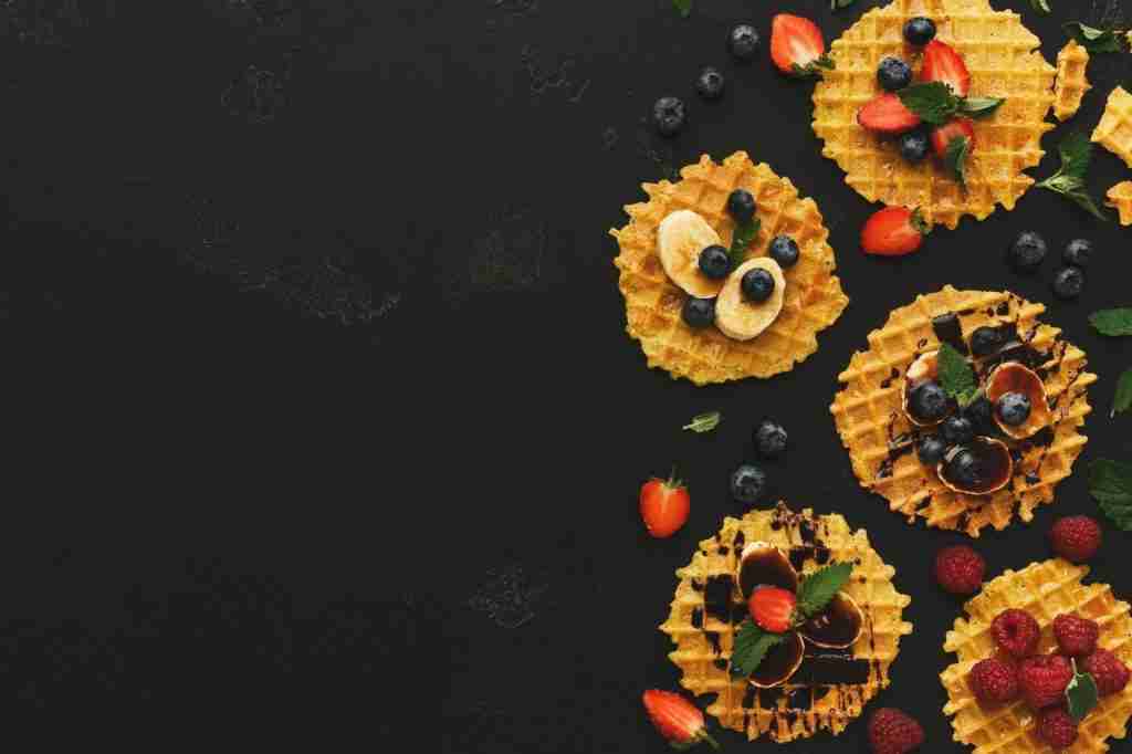 Waffles and fresh fruit breakfast background for travelers